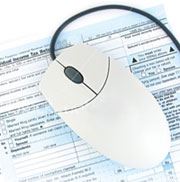 computer mouse on tax document
