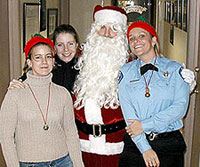 Police Officer and civilian staff pose with Santa